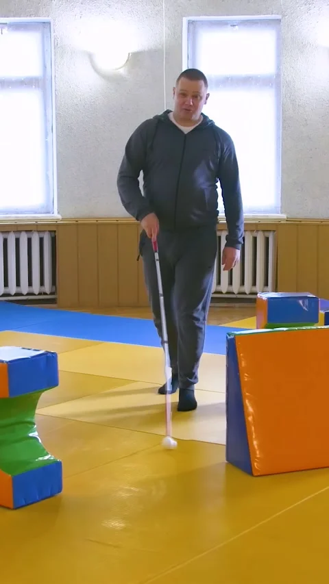Teaching the blind to walk with a cane. Vertical video. Stock Footage 303416021