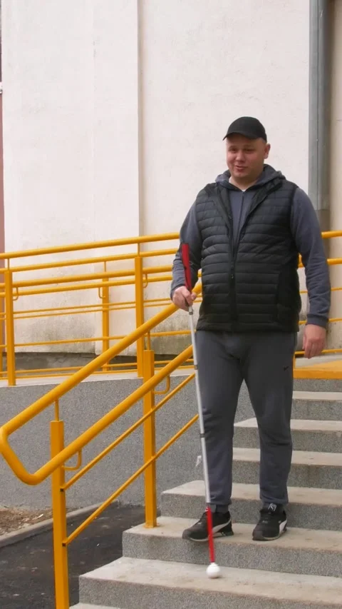 Teaching the blind to walk with a cane. Vertical video. 스톡 동영상 303416061