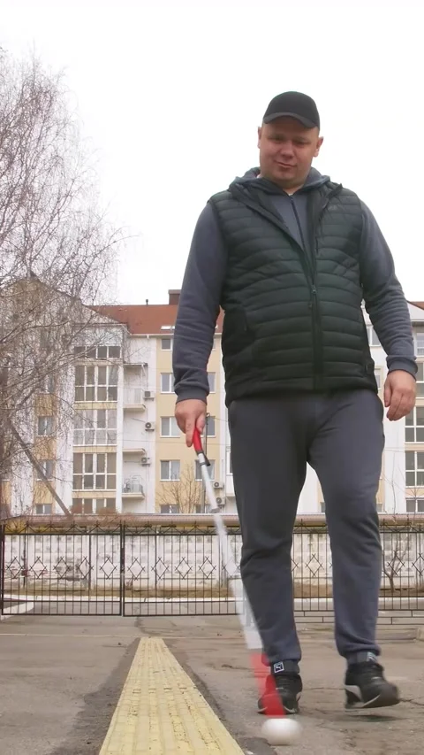 Teaching the blind to walk with a cane. Vertical video. Stock Footage 303416062