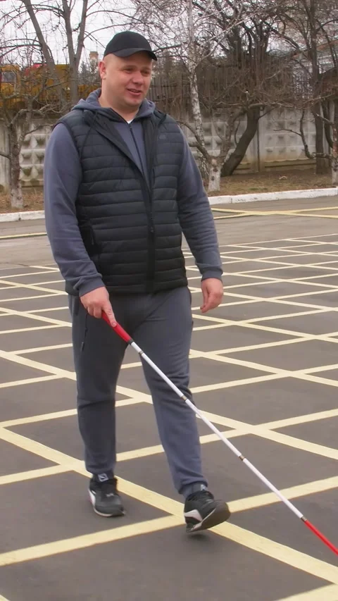 Teaching the blind to walk with a cane. Vertical video. 库存影片 303416073