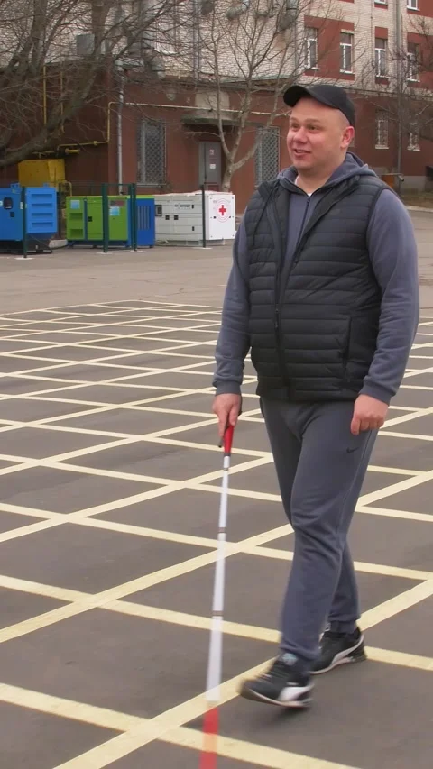 Teaching the blind to walk with a cane. Vertical video. Stock Footage 303416082