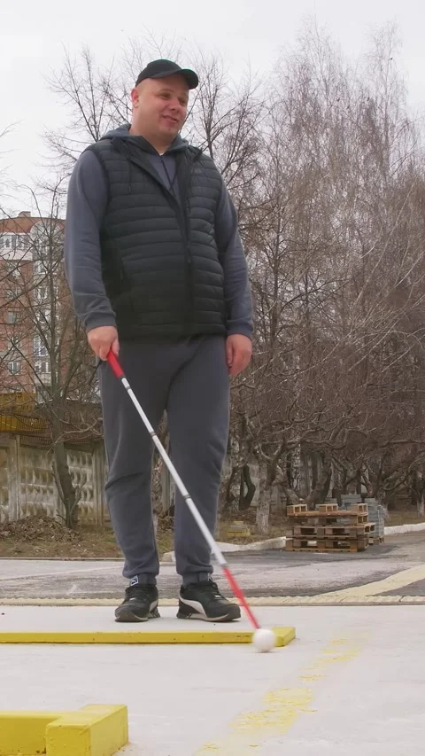 Teaching the blind to walk with a cane. Vertical video. Stock Footage 303416086