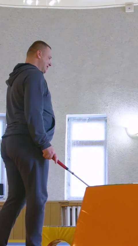 Teaching the blind to walk with a cane. Vertical video. Stock Footage 303416122