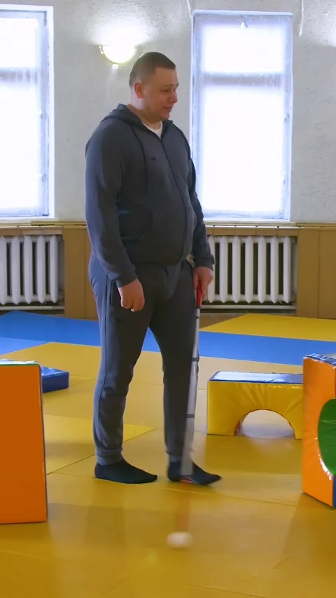 Teaching the blind to walk with a cane. Vertical video. Stock Footage 303416177