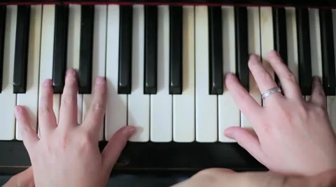 Teaching a child to play a piano Stock Footage 67893171