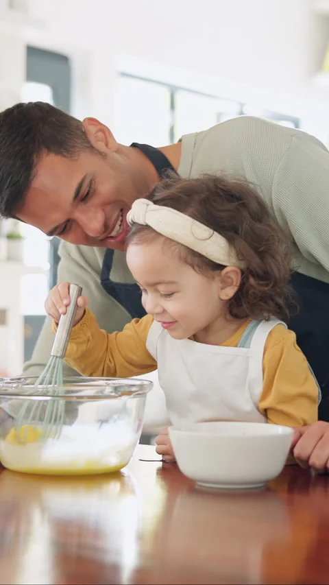 Teaching, egg and kid baking with dad in kitchen for recipe preparation in Stock-Footage 335362330