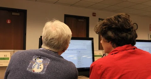 Teaching geneology on computer family data 4K Stock Footage 102407611