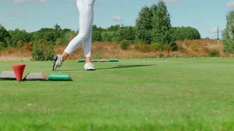 Teaching golfers on the driving range Stock Footage 217956335
