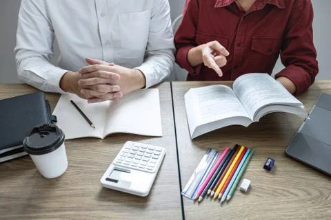 Teaching helping and study course, Team of young teacher or tutor helps stude Stock Photos