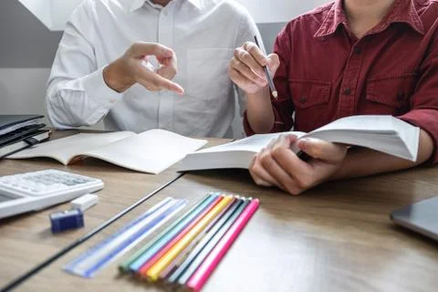 Teaching helping and study course, Team of young teacher or tutor helps stude Stock Photos