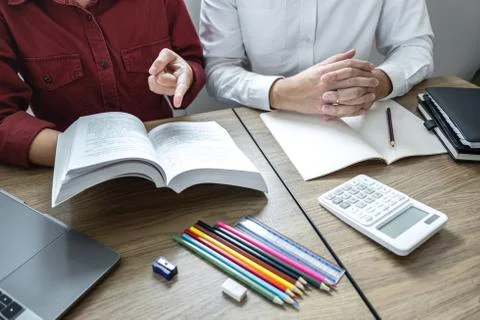 Teaching helping and study course, Team of young teacher or tutor helps stude Stock Photos