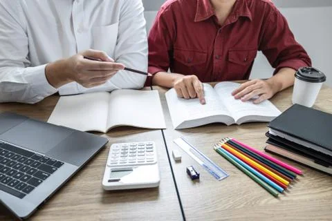 Teaching helping and study course, Team of young teacher or tutor helps stude Stock Photos