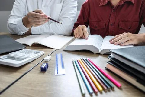 Teaching helping and study course, Team of young teacher or tutor helps stude Stock Photos