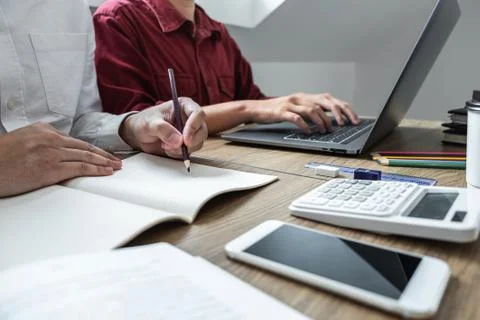 Teaching helping and study course, Team of young teacher or tutor helps stude Stock Photos