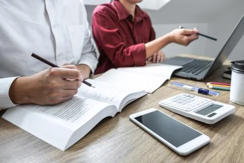 Teaching helping and study course, Team of young teacher or tutor helps stude Stock Photos