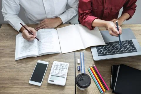 Teaching helping and study course, Team of young teacher or tutor helps stude Stock Photos