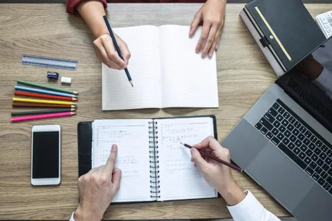 Teaching helping and study course, Team of young teacher or tutor helps stude Stock Photos