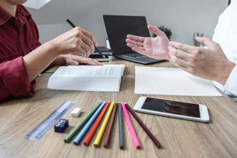 Teaching helping and study course, Team of young teacher or tutor helps stude Stock Photos