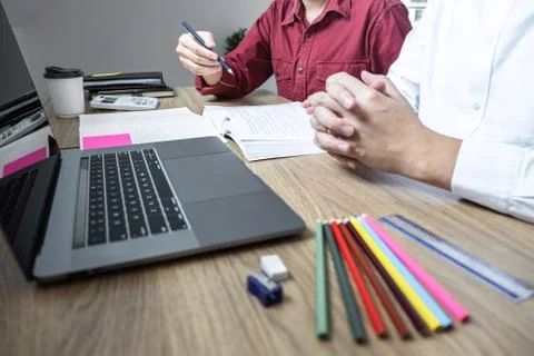 Teaching helping and study course, Team of young teacher or tutor helps stude Stock Photos