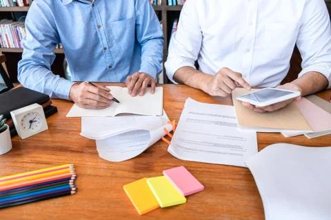 Teaching helping and study course, Team of young teacher or tutor helps stude Stock Photos