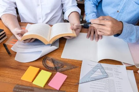 Teaching helping and study course, Team of young teacher or tutor helps stude Stock Photos