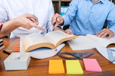 Teaching helping and study course, Team of young teacher or tutor helps stude Stock Photos