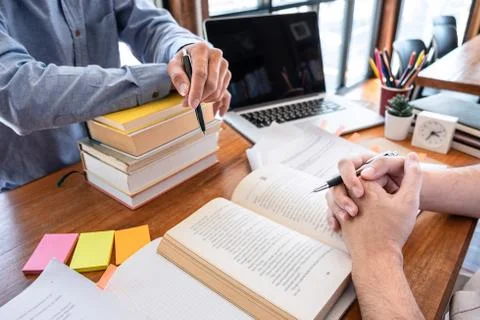 Teaching helping and study course, Team of young teacher or tutor helps stude Stock Photos