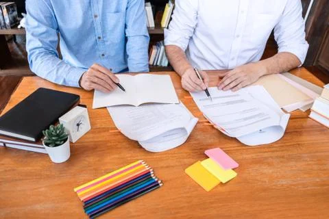 Teaching helping and study course, Team of young teacher or tutor helps stude Stock-Fotos