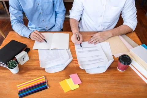 Teaching helping and study course, Team of young teacher or tutor helps stude Stock Photos