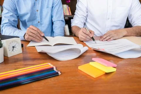 Teaching helping and study course, Team of young teacher or tutor helps stude Stock Photos