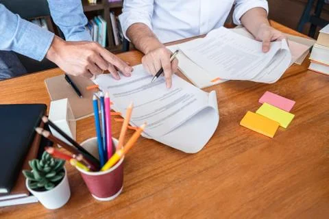 Teaching helping and study course, Team of young teacher or tutor helps stude Stock-Fotos