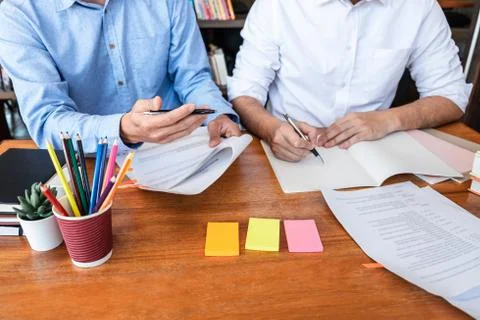 Teaching helping and study course, Team of young teacher or tutor helps stude Stock Photos