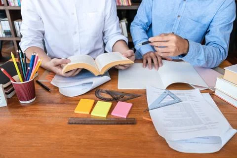 Teaching helping and study course, Team of young teacher or tutor helps stude Stock Photos