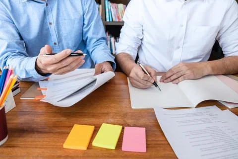 Teaching helping and study course, Team of young teacher or tutor helps stude Stock Photos