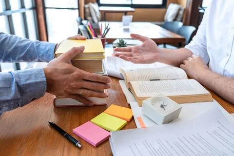 Teaching helping and study course, Team of young teacher or tutor helps stude Stock Photos