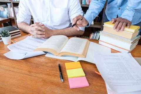 Teaching helping and study course, Team of young teacher or tutor helps stude Stock Photos