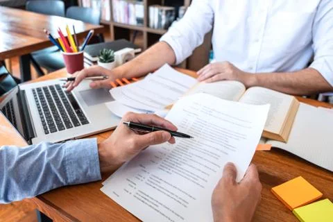 Teaching helping and study course, Team of young teacher or tutor helps stude Stock Photos