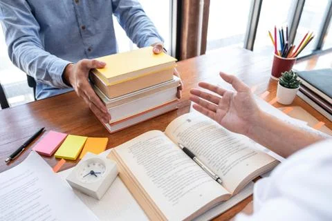 Teaching helping and study course, Team of young teacher or tutor helps stude Stock Photos