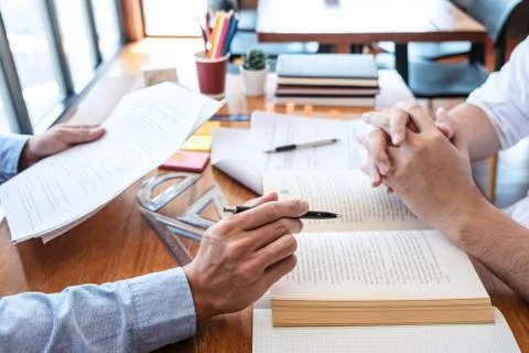 Teaching helping and study course, Team of young teacher or tutor helps stude Stock Photos