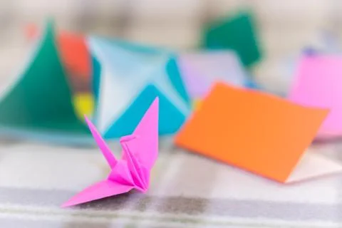 Teaching How to Make Crane from Small Piece of Origami Stock Photos