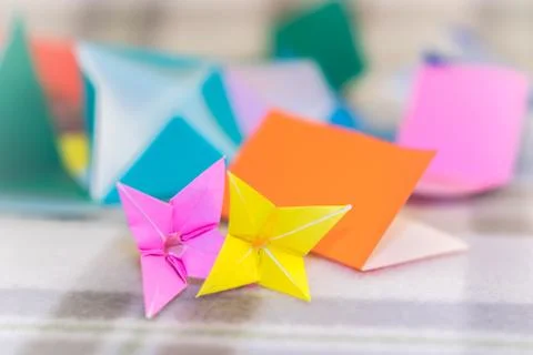 Teaching How to Make Lilly from Small Piece of Origami Stock Photos