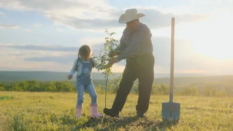 Teaching the Next Generation Tree Planting in the Countryside Stock Footage 309147291
