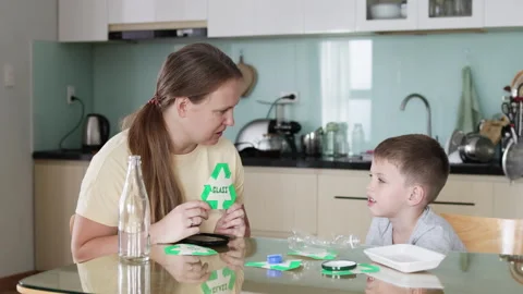 Teaching responsible waste sorting at home. Stock Footage 295015986