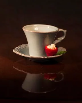 Teacup and Strawberry Stock Photos
