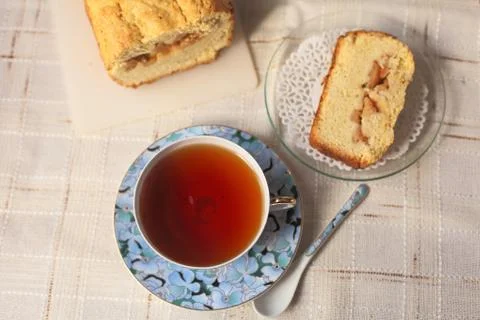 Teacup with cake Stock Photos