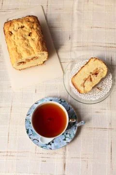 Teacup with cake Stock Photos
