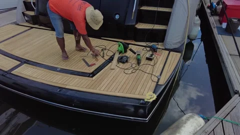 Teak work on the deck, tools in the background. Vídeo Stock 323259572