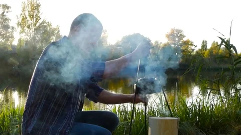 Teakettle on the fire outdoor Stock Footage 81768560