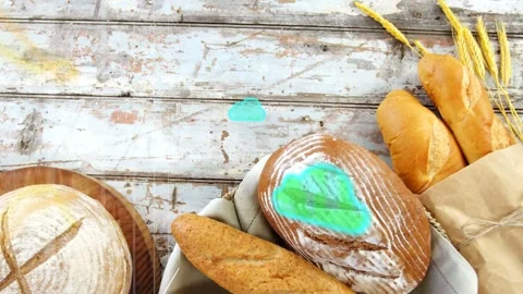 On teal blobs appearing, overlays sweeping across artisanal bread, view rising Stockbeeldmateriaal 333609895