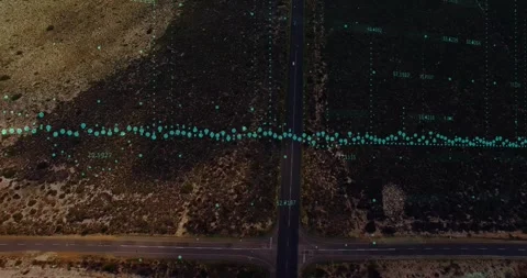 Teal data band tracking overhead crossroads, drone moving north revealing parcel Vidéo 330893851